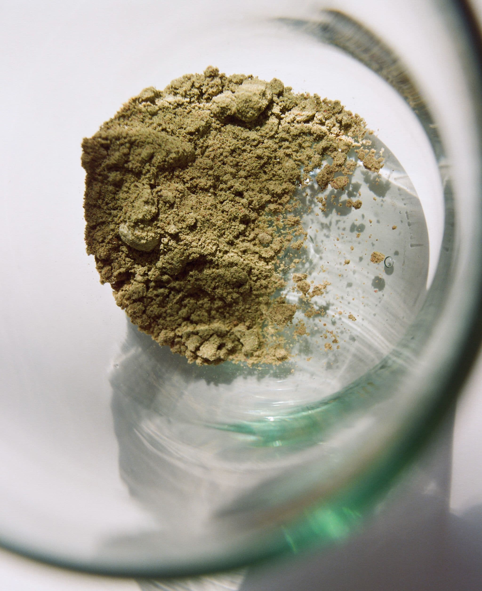 Ultimate Foundation powder in a glass